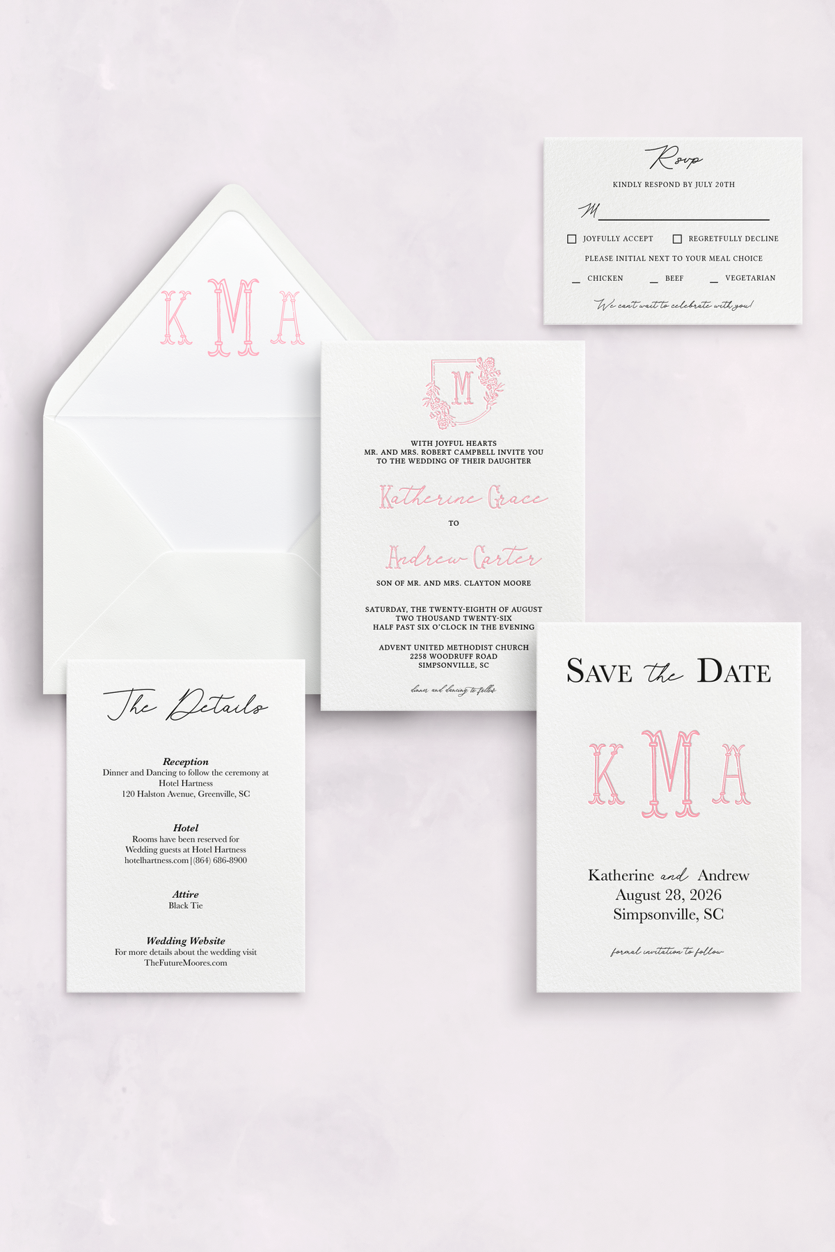 Custom lettepress wedding inviation suite with a pink monogram and floral crest.