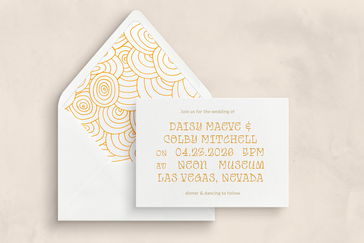 Custom letterpress wedding invitation card with orange geometric design envelope liner. 