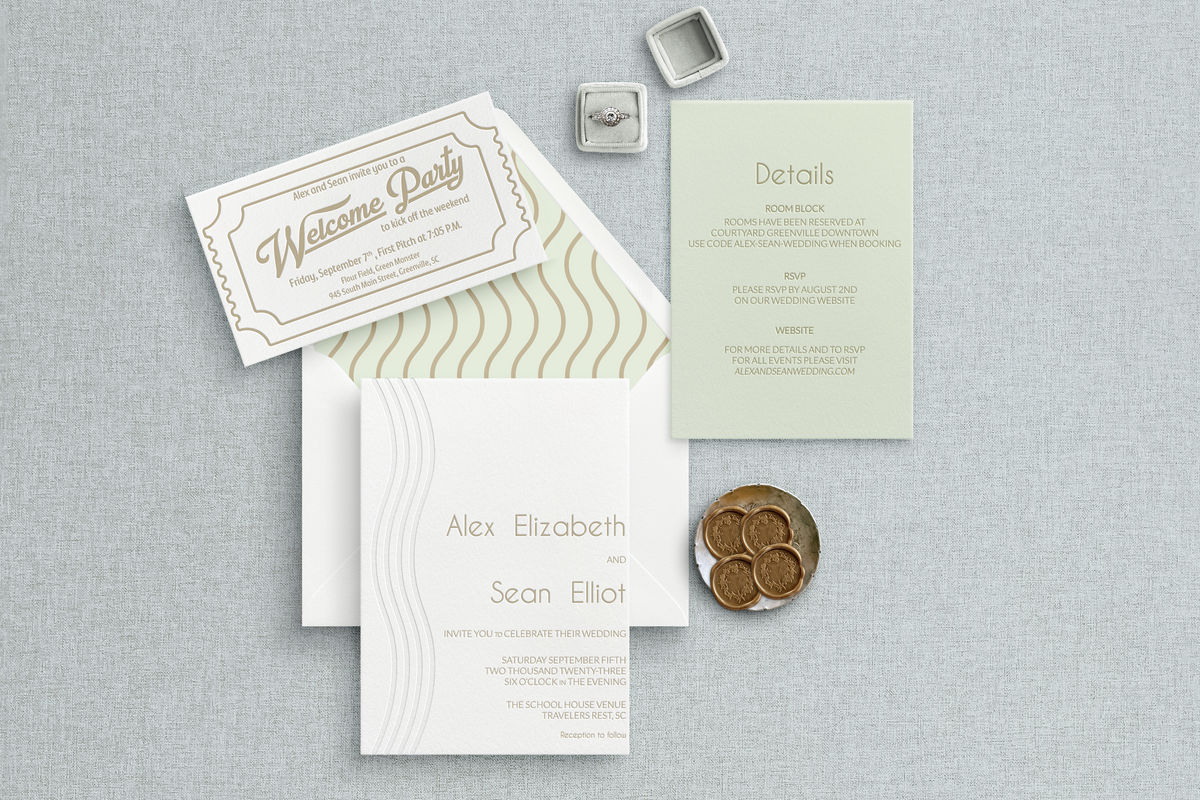 Custom Letterpress wedding invitation suite with waves, baseball ticket welcome party card, and green paper details card.
