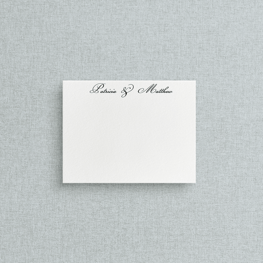 White card with custom letterpress text on a gray textured background