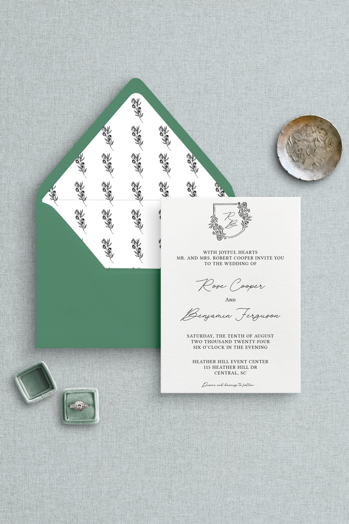 Semi-custom letterpress wedding inviation with a floral envelope liner and floral, monogram crest. 